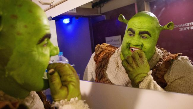 Shrek checks his teeth before heading out on stage. Picture: Mark Stewart