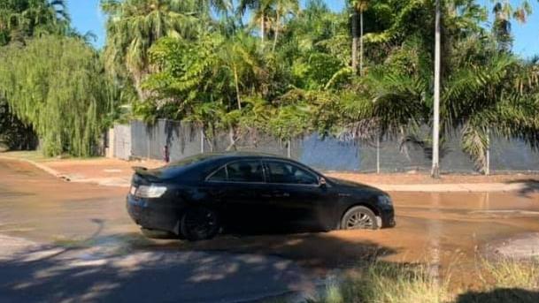 A car became stuck in a sink hole in Leanyer on Monday. Picture: Supplied