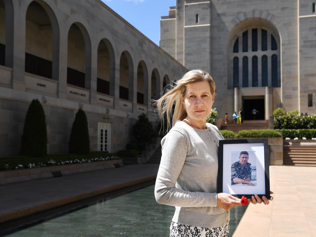 Julie Anne Finney poses for photographs next to the Pool of Reflection in the commemorative courtyard at the Australian War Memorial in Canberra Tracey Nearmy/Advertiser