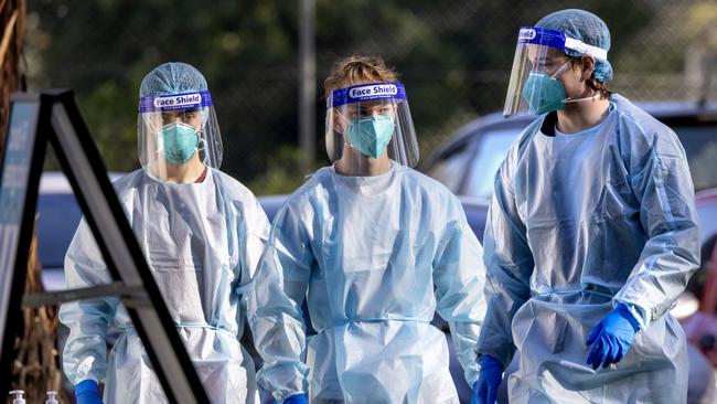 Health Department staff prepare for Covid testing outside at a public housing tower in Flemington. Picture: NCA NewsWire / David Geraghty