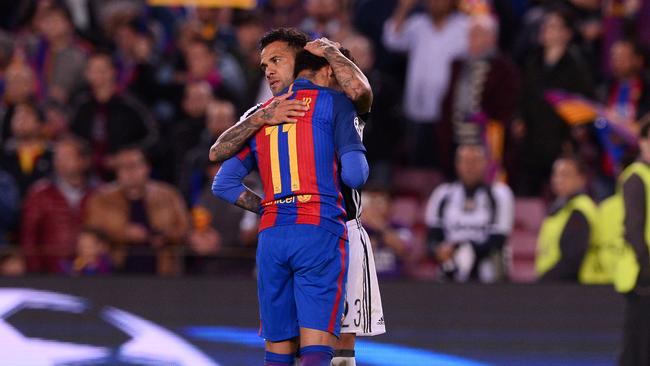 Barcelona's Neymar is comforted by Juventus' Dani Alves.