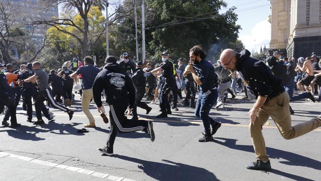 Angry protesters take to the streets of Melbourne.