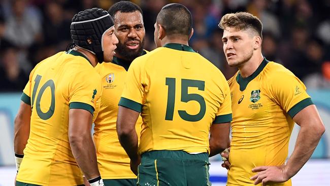 Wallabies Christian Lealiifano (L), Marika Koroibete (facing), Kurtley Beale (second right) and James O'Connor (right) during the Wallabies’ opening World Cup match against Fiji. Picture: AFP