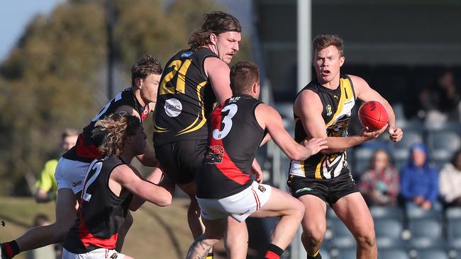 Kingborough skipper Lachie Clifford fires off a handball in the qualifying final against North Launceston two weeks’ ago. Picture: Nikki Davis-Jones