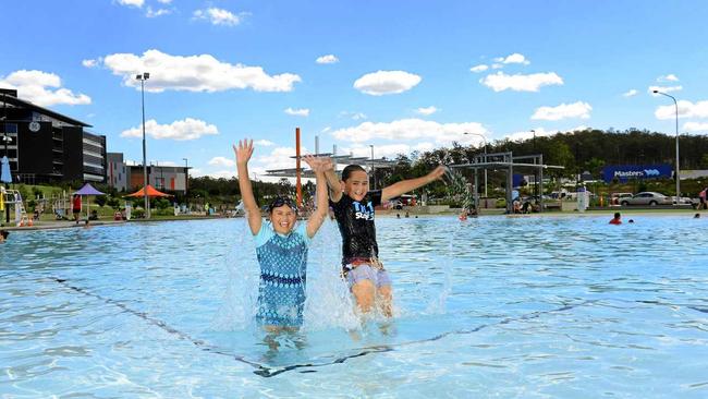 Caydence Waters, 10, and her brother Cyan, 8, having fun at Orion Lagoon. Picture: David Nielsen