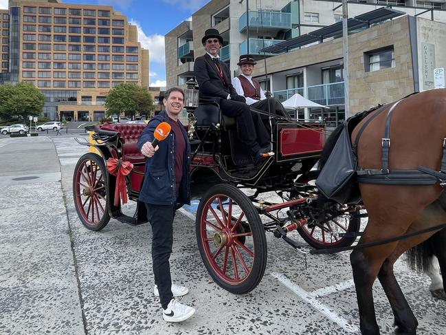 Sunrise presenter Sam Mac with the team from Hobart Heritage Horse Drawn Carriages. Picture: Genevieve Holding