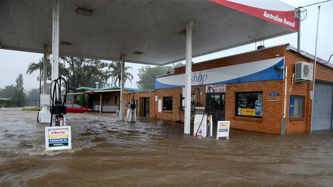 A petrol station at Telegraph Point was inundated with flood waters on Friday evening. Picture: Nathan Edwards