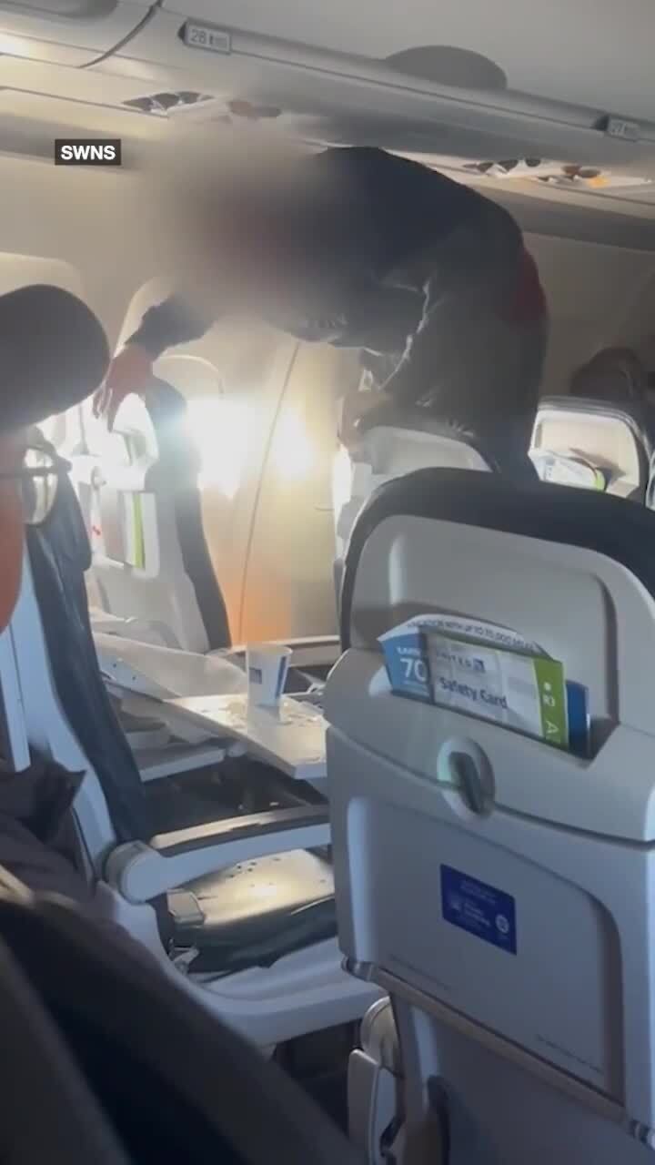 Wild footage shows man repeatedly kicking plane seat