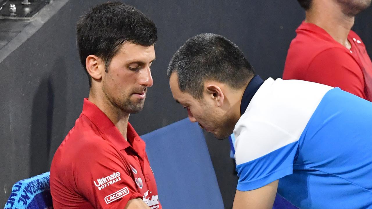Novak Djokovic of Serbia is seen receiving treatment on his arm.