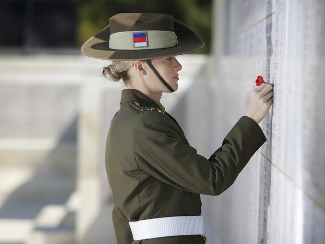 Private Hannah Bailey lays a poppy at the Lone Pine memorial wall dedicated to the missing. The walls adorning the memorial carry the names of 4228 Australians missing, as well as those who died on hospital ships and were buried at sea. Picture: ADF