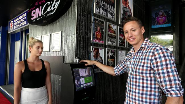 Sin City manager Charlie Embley showing the new ID scanner to Emma Barke in 2017. Photo: David Clark