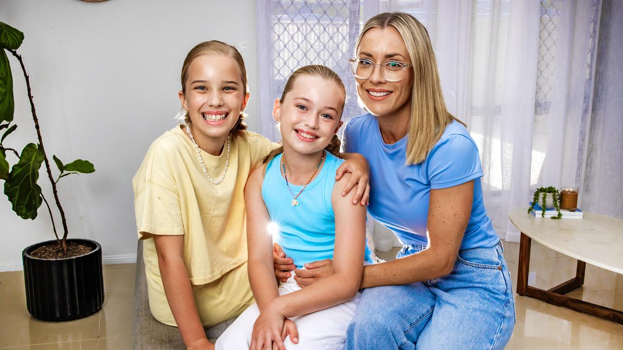 Lani Armitage, 9, with her sister Layla, 10 (left) and mum Carly. Picture: Nigel Hallett