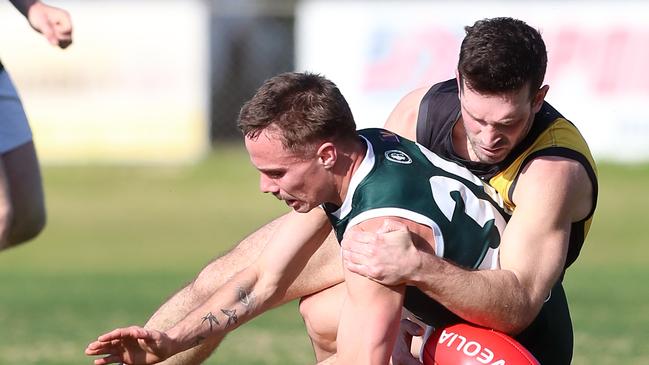 Rochester’s Nathan McCarty tackles Echuca’s Corbin Anderson.