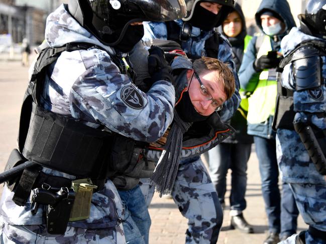 Police officers detain a man during a protest against Russian military action in Ukraine, in Manezhnaya Square in central Moscow. Picture: AFP