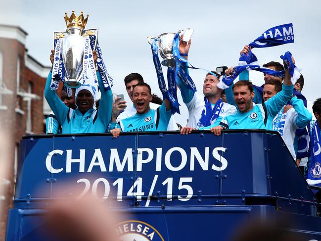 LONDON, ENGLAND - MAY 25: Didier Drogba and John Terry hold up the Premier League trophy and League Cup trophy as they exit the stadium during the Chelsea FC Premier League Victory Parade on May 25, 2015 in London, England, (Photo by Charlie Crowhurst/Getty Images)