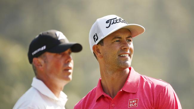 Matt Kuchar looks on as Adam Scott sizes up the second hole at the Genesis Open. Picture: Getty