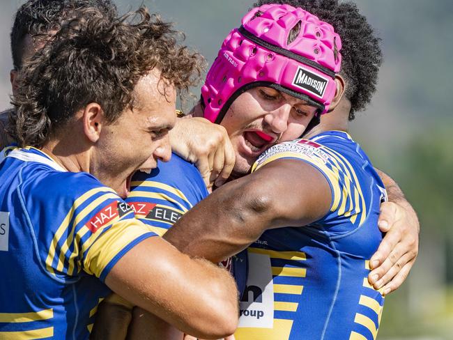 Kangaroos Daniel Woodhouse is congratulated by teammates after scoring a try against Suburbs. Picture: Brian Cassey