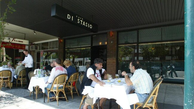 Diners eat on the footpath at Cafe Di Stasio in Fitzroy Street, St Kilda.