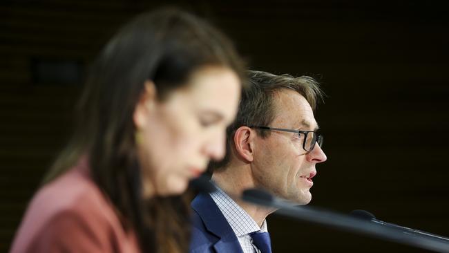 NZ Director-General of Health Dr Ashley Bloomfield, right, speaks to media while Prime Minister Jacinda Ardern looks on as the lockdown is announced. Picture: Hagen Hopkins/Getty Images