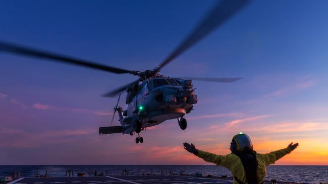 A MH-60R Seahawk helicopter “Voodoo” returns to the HMAS Hobart after flying operations during a regional presence deployment. Picture: Defence