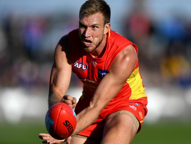 Sam Day of the Suns passes the ball during the Round 7 AFL match between the Western Bulldogs and the Gold Coast Suns at Mars Stadium in Ballarat, Victoria, Saturday, May 5, 2018. (AAP Image/Joe Castro) NO ARCHIVING, EDITORIAL USE ONLY