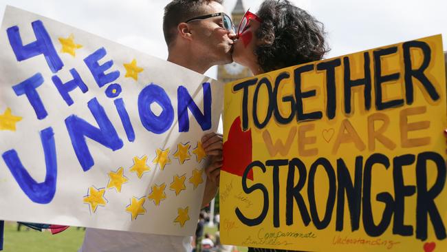 People pose kissing each other in a kiss chain organised by pro-Europe 'remain' campaigners seeking to avoid a Brexit in the EU referendum in Parliament Square. Picture: AFP