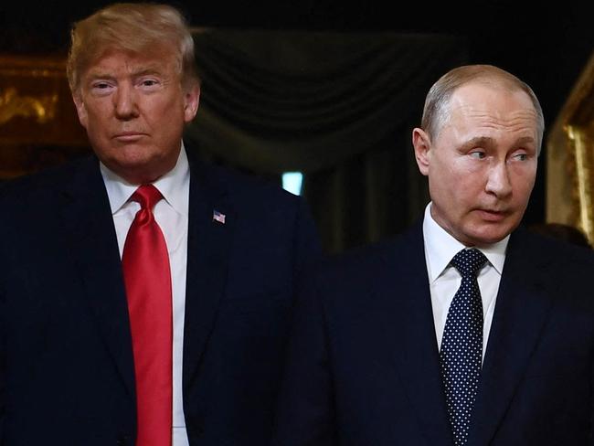 (FILES) US President Donald Trump (L) and Russian President Vladimir Putin arrive for a meeting in Helsinki, on July 16, 2018. US President-elect Donald Trump suggested November 7, 2024 that he would likely speak with Russia's President Vladimir Putin, NBC News reported, after the Republican was swept to victory in the US presidential election. (Photo by Brendan Smialowski / AFP)