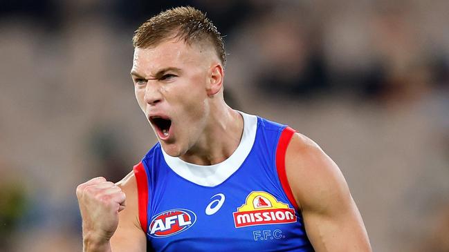 MELBOURNE - APRIL 08: Robbie McComb of the Bulldogs celebrates a goal during the 2023 AFL Round 04 match between the Richmond Tigers and the Western Bulldogs at the Melbourne Cricket Ground on April 8, 2023 in Melbourne, Australia. (Photo by Dylan Burns/AFL Photos via Getty Images)