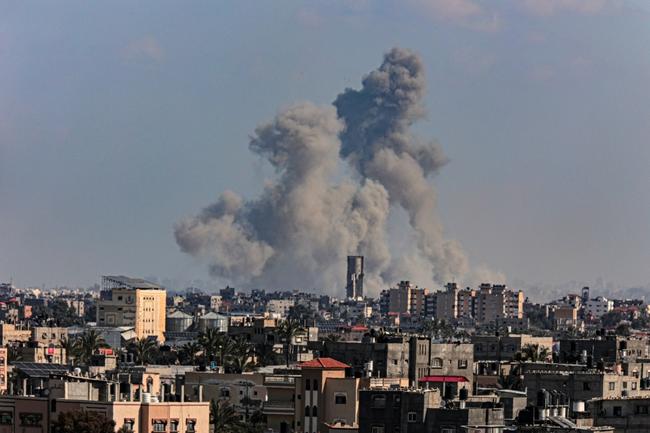 Smoke billows over Khan Yunis in the southern Gaza Strip on the first day of Ramadan