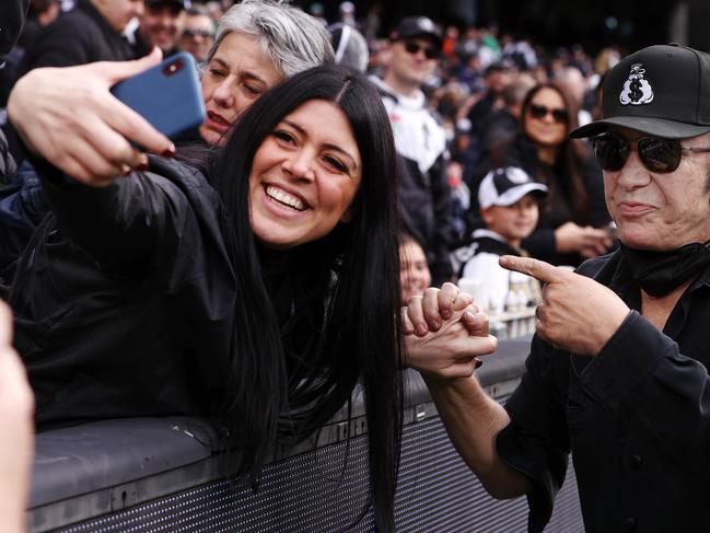 Carlton Blues fan Gene Simmons presents the match-day ball for the clash against the Collingwood Magpies at the MCG. Picture: Michael Klein