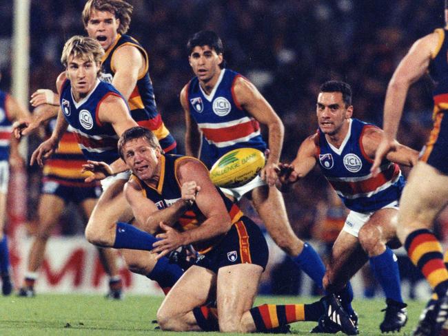 Chris McDermott fires out a handpass against the Bulldogs in 1995Jun 1995. Picture: Neon Martin