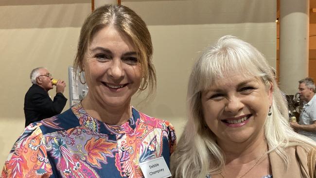 Debbie Champney and Karen Pooley celebrate the 50th anniversary of the Rainbows Rugby League Football Club at its golden jubilee at the Gympie Showgrounds Pavilion on the night of June 3, 2023.