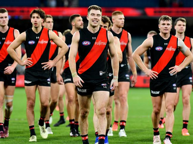 MELBOURNE, AUSTRALIA - JUNE 09: The Bombers look dejected after losing the round 13 AFL match between Essendon Bombers and Carlton Blues at Melbourne Cricket Ground, on June 09, 2024, in Melbourne, Australia. (Photo by Josh Chadwick/Getty Images)