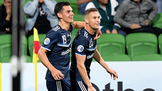 Jai Ingham of Melbourne Victory is congratulated by team mate Pierce Waring (left) after scoring a goal during the AFC Champions League. (AAP Image/Joe Castro)