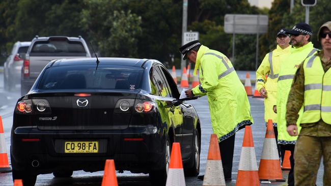 GOLD COAST, AUSTRALIA – NewsWire Photos AUGUST 7, 2020: Police check cars at the Queensland border with NSW at Stuart St, Coolangatta. Picture: NCA NewsWire/Steve Holland