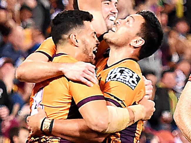 Alex Glenn of the Broncos celebrates with team mates after scoring a try during the Round 16 NRL match between the Brisbane Broncos and the Canberra Raiders at Suncorp Stadium in Brisbane, Saturday, June 30, 2018. (AAP Image/Albert Perez) NO ARCHIVING, EDITORIAL USE ONLY