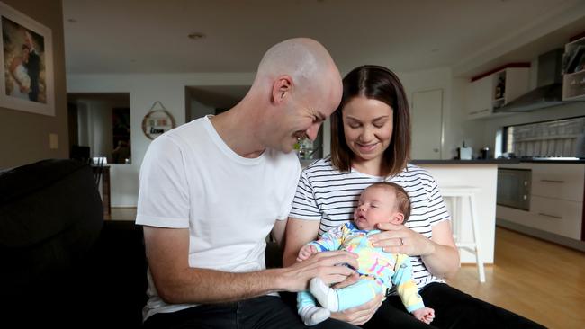 New parents Adam and Caitlin Doolan with eight-week-old son Ralph. Picture: David Geraghty