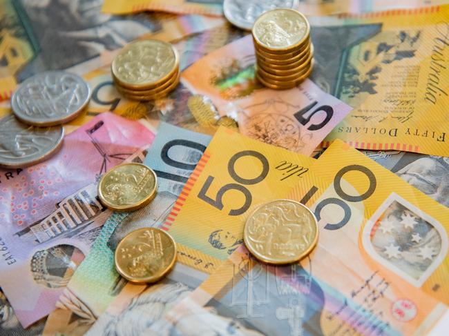 Australian notes and coins spilled out on a table