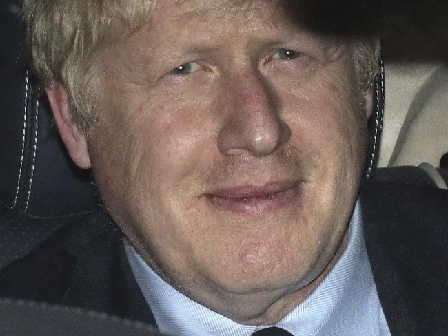 Prime Minister Boris Johnson leaves the House of Commons in London, Tuesday, Sept. 3, 2019, after MPs voted in favor of allowing a cross-party alliance to take control of the Commons agenda on Wednesday in a bid to block a no-deal Brexit on October 31. (Aaron Chown/PA via AP)