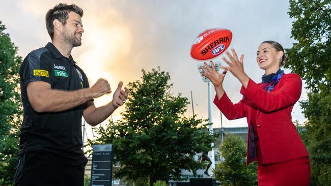 Richmond captain Trent Cotchin with flight attendant Courtney Denis at a Virgin Australia/AFL partnership announcement.