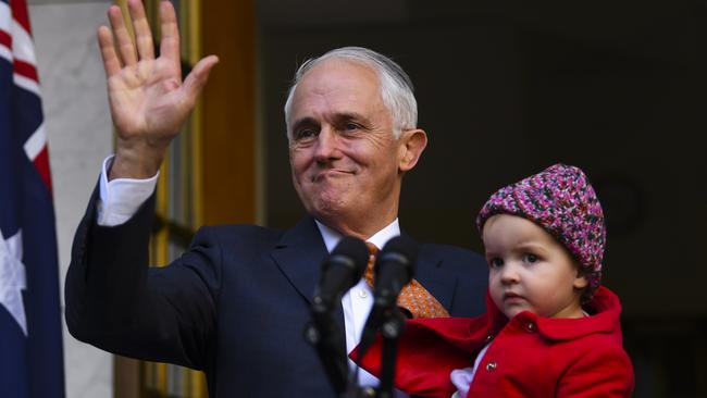 Malcolm Turnbull waves as he holds his granddaughter, Alice.Picture: AAP.