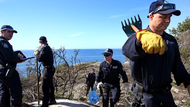 Police search an area on North Head near Manly yesterday after Scott White’s arrest. Picture: Toby Zerna