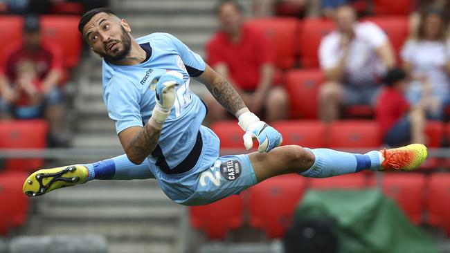 Adelaide United goalkeeper Paul Izzo makes a save on Saturday night.