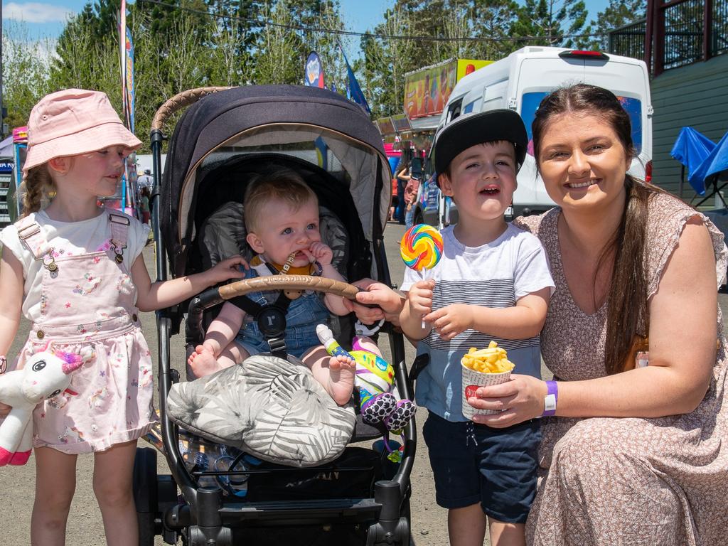 Kyogle locals Brittany with Zara, Asher, and Ryan enjoying hot chips, face-painting, and ice creams at the Kyogle Show. Picture: Cath Piltz