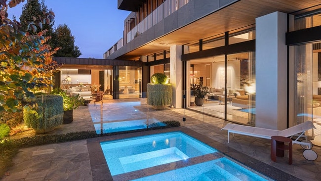 The backyard pool zone is surrounded by Paul Bangay-designed gardens.