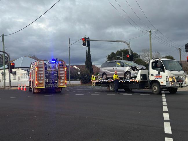 Paramedics assess three patients after busy intersection smash