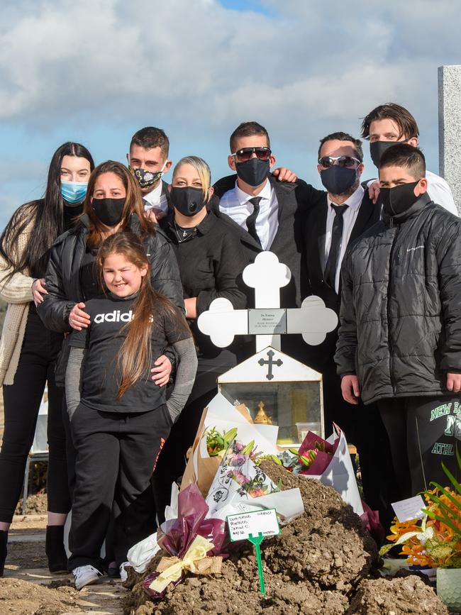 Mr Roussos’ family at his graveside. Picture: Alex Coppel