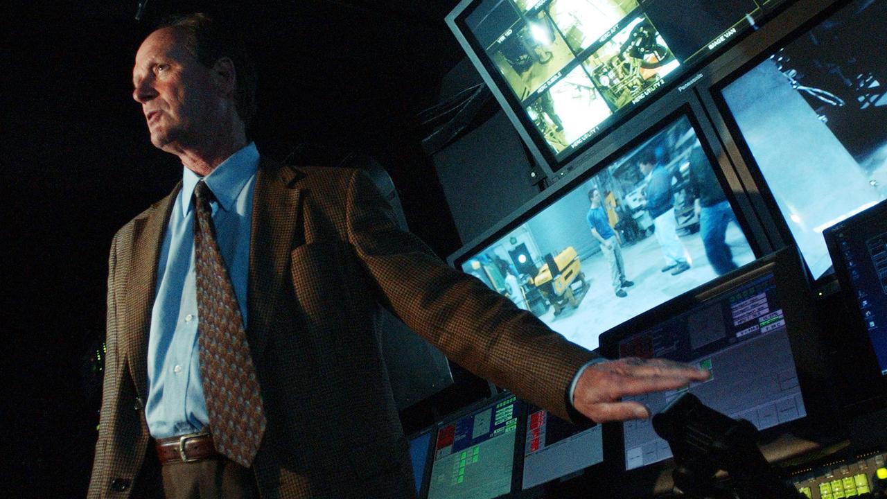 Underwater explorer Robert Ballard who discovered the wreck of the Titanic pointing out remote vehicle control device while inside command and control centre at University of Rhode Island Narragansett 15 Apr 2004.