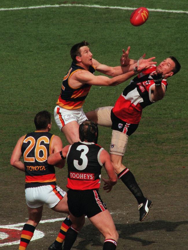 Mark Bickley, left, ready to rove alongside Saints champ Nathan Burke as Shaun Rehn and Brett Cook contest the ruck in the 1997 grand final.