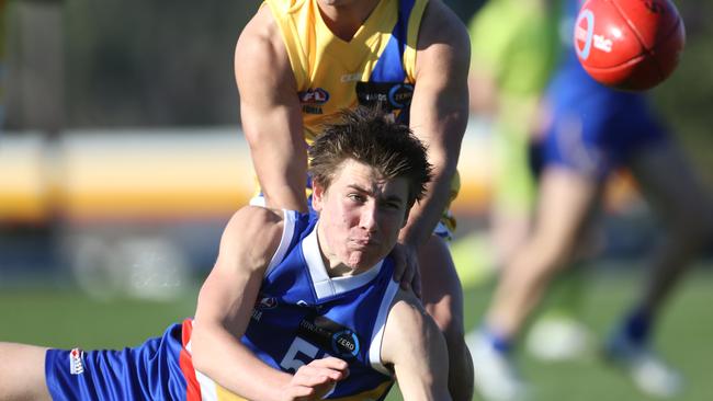 TAC Cup: Eastern Ranges v Western Jets.55 Chayce Black handballs for the  Eastern Ranges.Picture: Stuart Milligan